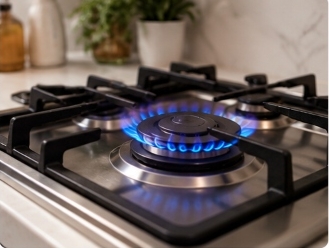 Clean modern kitchen stainless steel gas hob with clean burning blue flame